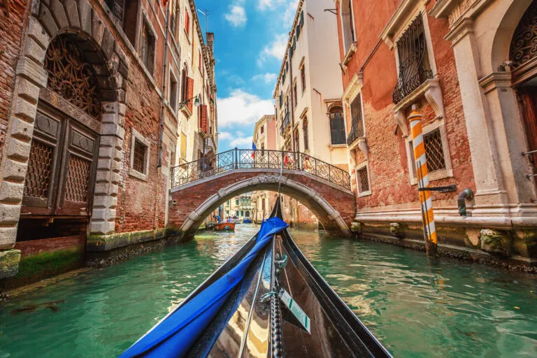 View from gondola during the ride through the canals of Venice i