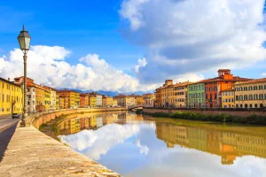 Stroll by the scenic Arno River in Pisa